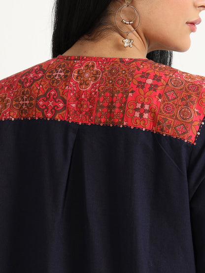 Navy blue dress with red detailing