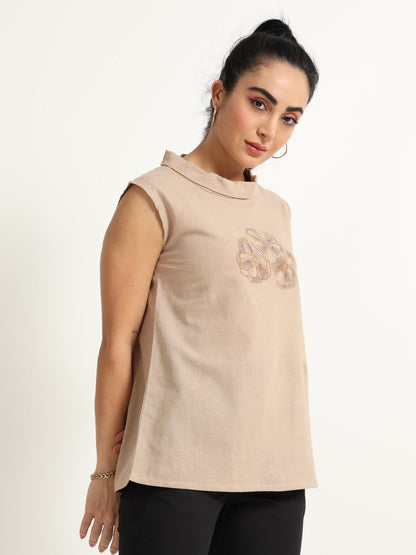 A Simple Sleeveless Top With Thread Embroidery Detailing