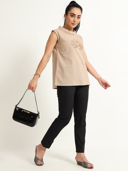 A Simple Sleeveless Top With Thread Embroidery Detailing